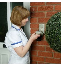 Outdoor Key Safe with black weatherproof hinged cover.